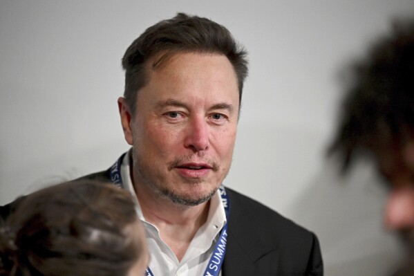 File - Tesla CEO Elon Musk attends the first plenary session of the AI Safety Summit at Bletchley Park, on Nov. 1, 2023 in Bletchley, England. A Delaware judge this week invalidated Elon Musk's $55.8 billion Tesla pay package, saying it is too big and that Musk set the terms with a complaint board. (Leon Neal/Pool Photo via AP, File)