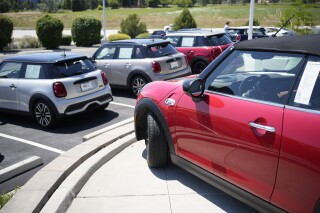 FILE - Used models are shown a Mini dealership on July 21, 2023, in Highlands Ranch, Colo. The average used car price is up 16% from three years ago. (AP Photo/David Zalubowski, File)