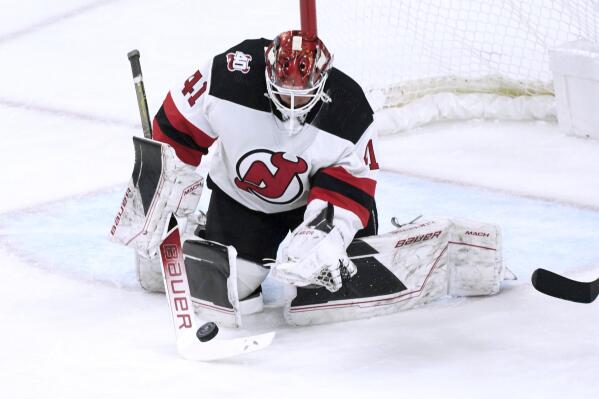 New Jersey Devils goalie Vitek Vanecek stops a Minnesota Wild shot during the first period of an NHL hockey game Saturday, Feb. 11, 2023, in St. Paul, Minn. (AP Photo/Jim Mone)
