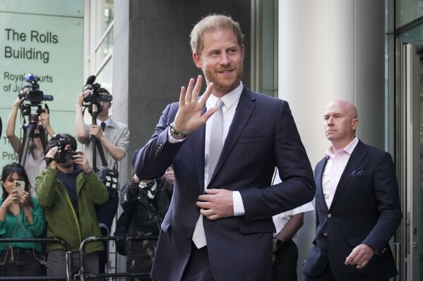 FILE - Prince Harry leaves the High Court after giving evidence in London, Wednesday, June 7, 2023. A London judge has allowed Prince Harry's lawsuit against the publisher of The Sun tabloid to go to trial on claims the newspaper used unlawful methods to gather information about him. (AP Photo/Kin Cheung, File)