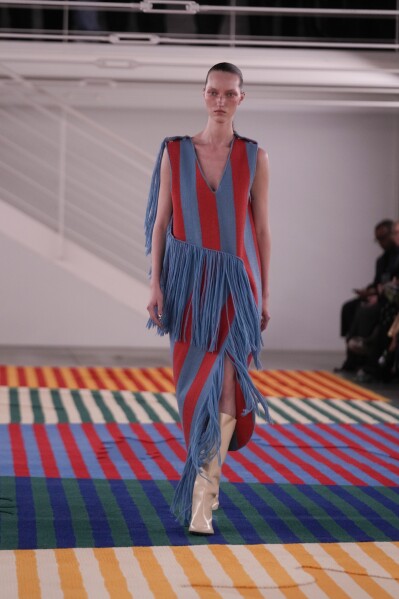 A model wears a creation as part of the Sunnei women's Fall-Winter 2024-25 collection presented in Milan, northern Italy, Friday, Feb. 23, 2024. (AP Photo/Luca Bruno)