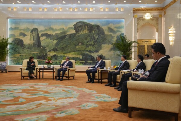 U.S. Commerce Secretary Gina Raimondo, left, talks to Chinese Premier Li Qiang, second left, during a meeting at the Great Hall of the People in Beijing, Tuesday, Aug. 29, 2023. (AP Photo/Andy Wong, Pool)
