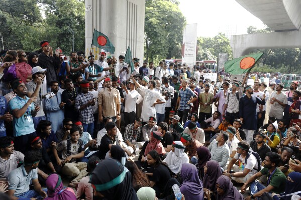 Students shout slogans as they demand the resignation of Bangladesh's Chief Justice Obaidul Hassan and other senior judges during a public protest in Dhaka, Bangladesh, Saturday, Aug. 10, 2024. (AP Photo/Rajib Dhar)