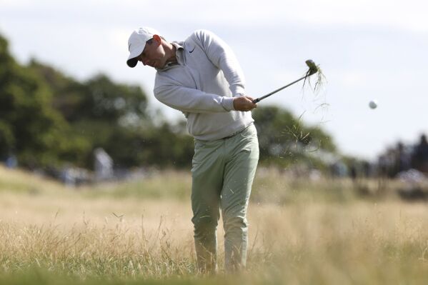 Northern Ireland's Rory McIlroy plays a shot on the 18th fairway on day one of the Genesis Scottish Open 2023 at The Renaissance Club, in North Berwick, Scotland, Thursday, July 13, 2023. (Steve Welsh/PA via AP)