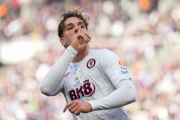 Aston Villa's Nicolo Zaniolo celebrates after scoring his side's opening goal during the English Premier League soccer match between West Ham and Aston Villa, at the London stadium in London, Sunday, March 17, 2024. (AP Photo/Kirsty Wigglesworth)