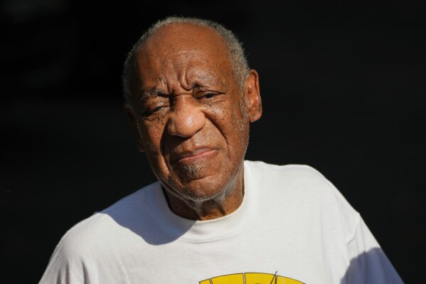 FILE - Bill Cosby reacts outside his home in Elkins Park, Pa., June 30, 2021, after being released from prison. A woman who worked as a stand-in at “The Cosby Show” in the 1980s said in a lawsuit Tuesday, Nov. 21, 2023, that Cosby drugged and sexually abused her after offering to mentor her in her acting career. (AP Photo/Matt Slocum, File)