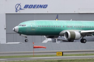 FILE - In this April 10, 2019, file photo, a Boeing 737 Max 8 airplane lands following a test flight at Boeing Field in Seattle. Federal investigators have confirmed in a report Thursday, March 7, 2023, an account by pilots who say the rudder controls on their Boeing Max jetliner failed during a landing last month. (AP Photo/Ted S. Warren, File)