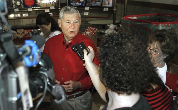 FILE - Sen. Bob Graham, D-Fla., speaks with the media during his 408th and final workday in Islamorada, Fla., Wednesday, Dec. 22, 2004. Graham, who gained national prominence as chairman of the Senate Intelligence Committee in the aftermath of the 2001 terrorist attacks and as an early critic of the Iraq war, has died, Tuesday, April 16, 2024. He was 87. (AP Photo/Hillery Smith Shay, File)