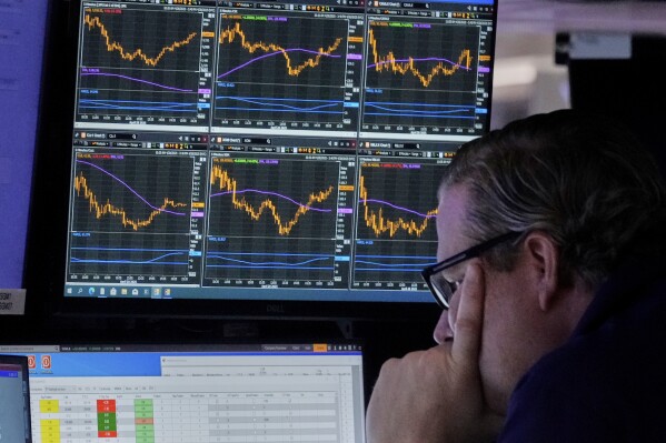 Specialist Gregg Maloney works at his post on the floor of the New York Stock Exchange, Monday, April 28, 2025. (AP Photo/Richard Drew)