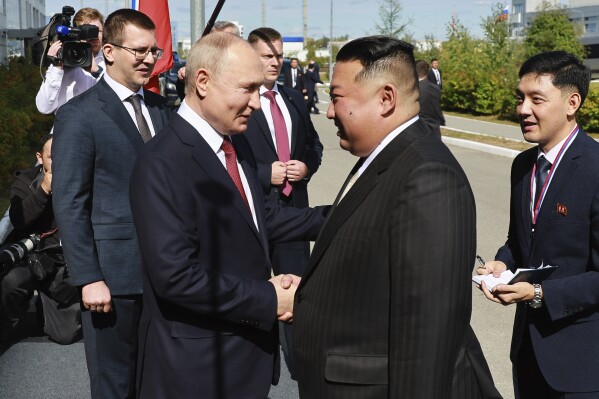 Russian President Vladimir Putin, left, and North Korea's leader Kim Jong Un shake hands during their meeting at the Vostochny cosmodrome outside the city of Tsiolkovsky, about 200 kilometers (125 miles) from the city of Blagoveshchensk in the far eastern Amur region, Russia, on Wednesday, Sept. 13, 2023. (Vladimir Smirnov, Sputnik, Kremlin Pool Photo via AP)