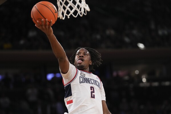 UConn guard Tristen Newton goes to the basket during the first half of the team's NCAA college basketball game against St. John's in the semifinals of the Big East men's tournament Friday, March 15, 2024, in New York. (AP Photo/Mary Altaffer)