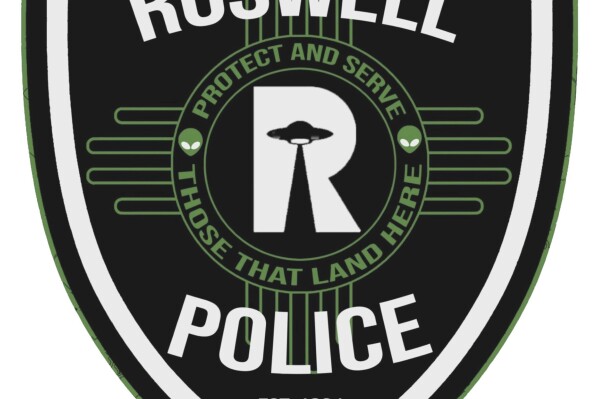 This image provided by the Roswell Police Dept. shows the new uniform patch. Famous for being the spot where a spacecraft purported crashed in 1947, Roswell, New Mexico, has become a mecca for people fascinated by extraterrestrial phenomenon. So it's only fitting that the city’s police force has uniform patches that are out of this world. The new patch was unveiled on Friday, March 8, 2024. (Roswell Police Dept. via AP)