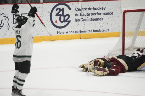 Boston's Amanda Pelkey (16) celebrates her goal past Montreal goaltender Ann-Renee Desbiens (35) during overtime of a PWHL hockey game in Montreal, Saturday, Jan. 13, 2024. (Christinne Muschi/The Canadian Press via AP)
