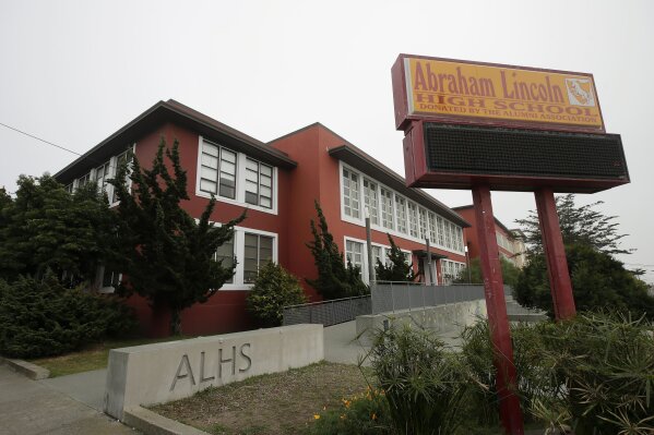 FILE - In this March 12, 2020, file photo, is the Abraham Lincoln High School in San Francisco. The city of San Francisco took a dramatic step Wednesday, Feb. 3, 2021, in its effort to get children back into public school classrooms, suing its own school district to try to force open the doors amid the coronavirus pandemic. The lawsuit was the first of its kind in California and possibly the country, as school systems come under increasing pressure from parents and politicians to end virtual learning. (AP Photo/Jeff Chiu, File)