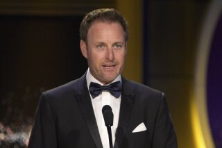FILE - In this April 29, 2018, file photo, Chris Harrison presents the award for outstanding entertainment talk show host at the Daytime Emmy Awards at the Pasadena Civic Center in Pasadena, Calif. Harrison will not host the upcoming season of “The Bachelorette” following controversy over racially insensitive comments, and will instead be replaced with two former contestants, ABC Entertainment and Warner Horizon said in a statement Friday, March 12, 2021. (Photo by Richard Shotwell/Invision/AP, File)