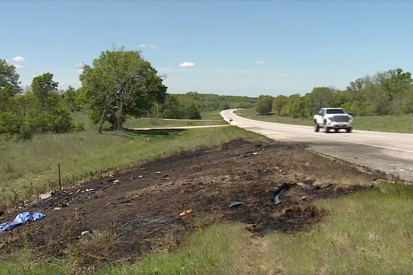 This image taken from video from May 5, 2025, shows charred earth at the site of a fatal vehicle collision in Franklin County, Kans. (KMBC 9 News via AP)