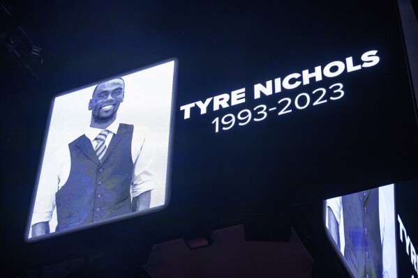 FILE - The screen at the Smoothie King Center in New Orleans honors Tyre Nichols before an NBA basketball game between the New Orleans Pelicans and the Washington Wizards, Jan. 28, 2023. Desmond Mills Jr., a former Memphis police officer, is changing his plea from not guilty on federal charges that he violated Nichols' civil rights by fatally beating him after a traffic stop in January 2023. A change of plea hearing has been scheduled for Thursday, Nov. 2, for Mills Jr., according to court documents and his lawyer. (AP Photo/Matthew Hinton, File)