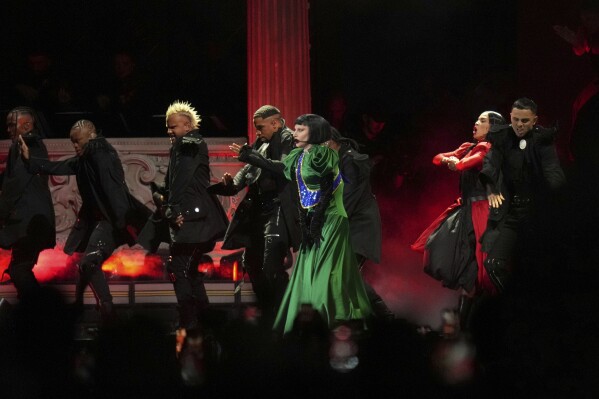 Lady Gaga, center, performs during her free concert on Copacabana Beach in Rio de Janeiro, Saturday, May 3, 2025. (AP Photo/Silvia Izquierdo)