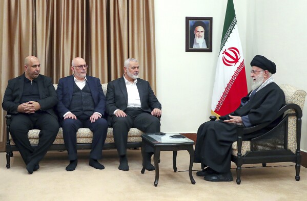 In this portray launched by an legitimate internet self-discipline of the administrative heart of the Iranian supreme chief, Supreme Leader Ayatollah Ali Khamenei, appropriate, speaks in a gathering with Hamas chief Ismail Haniyeh, 2nd appropriate, and his delegation, in Tehran, Iran, Tuesday, March 26, 2024. (Space of enterprise of the Iranian Supreme Leader by task of AP)