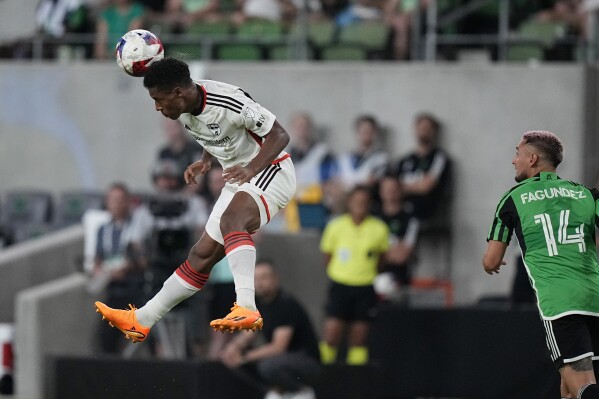 FC Dallas defender Geovane Jesus, left, heads the ball in front of Austin FC forward Diego Fagundez (14) during the second half of an MLS soccer match in Austin, Texas, Wednesday, June 21, 2023. (AP Photo/Eric Gay)