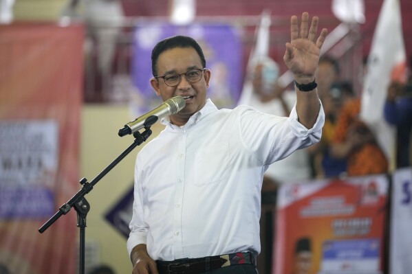 Presidential candidate Anies Baswedan gestures as he delivers a speech during his campaign rally at a stadium in Jakarta, Indonesia, Tuesday, Nov. 28, 2023. Candidates officially began their campaign for next year's election which will determine who will succeed President Joko Widodo who is now serving his second and final term. (AP Photo/Achmad Ibrahim)