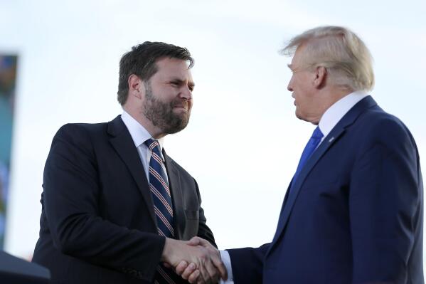 FILE - Senate candidate JD Vance, left, greets former President Donald Trump at a rally at the Delaware County Fairgrounds, Saturday, April 23, 2022, in Delaware, Ohio, to endorse Republican candidates ahead of the Ohio primary on May 3. On Tuesday voters in Ohio choose between the Trump-backed JD Vance for an open U.S. Senate seat and several other contenders who spent months clamoring for the former president's support.  (AP Photo/Joe Maiorana, File)