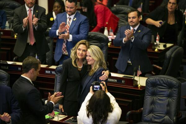 State Reps. Jennifer Canady, left, and Jenna Persons-Mulicka embrace after the Republican-dominated Legislature on approved a ban on abortions after six weeks of pregnancy, Thursday, April 13, 2023, in Tallahassee, Fla. (Alicia Devine/Tallahassee Democrat via AP)