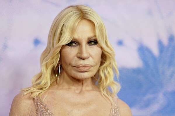 Donatella Versace out as creative director of the Milan fashion house, in a  shakeup by US owner | AP News