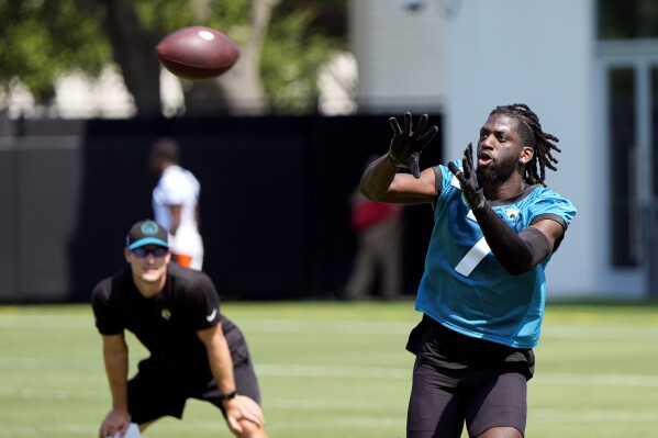 Jacksonville Jaguars wide receiver Brian Thomas Jr. makes a reception during the team's NFL football practice, Tuesday, May 28, 2024, in Jacksonville, Fla. (AP Photo/John Raoux)