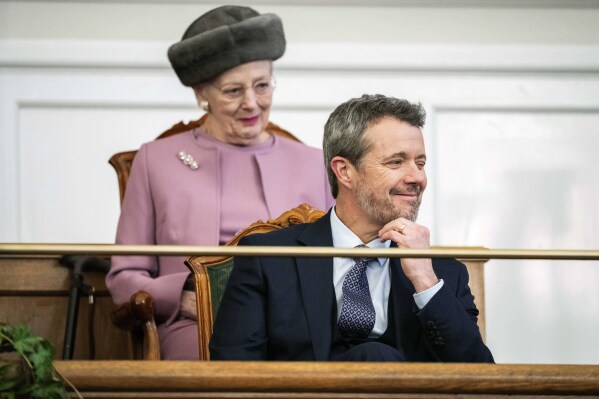 Denmark's King Frederik X and Queen Margrethe attend Folketingsalen, the Danish Parliament, at Christiansborg Castle, in Copenhagen, Monday, Jan. 15, 2024. Denmark’s new King Frederik X has visited the Danish parliament on his first formal day on the job. His mother, Queen Margrethe, abdicated on Sunday after 52 years on the throne, the first Danish monarch to do so in nearly 900 years. (Ida Marie Odgaard/Ritzau Scanpix via AP)