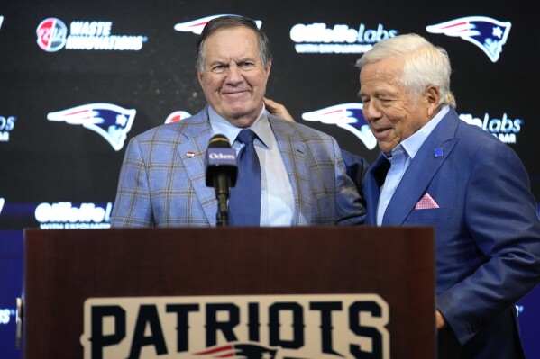 Former New England Patriots head coach Bill Belichick, left, and Patriots team owner Robert Kraft, right, stand together during an NFL football news conference, Thursday, Jan. 11, 2024, in Foxborough, Mass., to announce that Belichick, a six-time NFL champion, has agreed to part ways with the team. (AP Photo/Steven Senne)