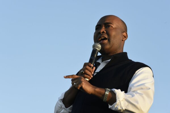 FILE - In this Oct. 17, 2020, file photo then-Democratic U.S. Senate candidate Jaime Harrison speaks at a campaign rally in North Charleston, S.C. Harrison, the failed South Carolina Senate candidate and longtime Democratic Party official, is President-elect Joe Biden’s choice to lead the national party, according to multiple party officials. (AP Photo/Meg Kinnard, File)