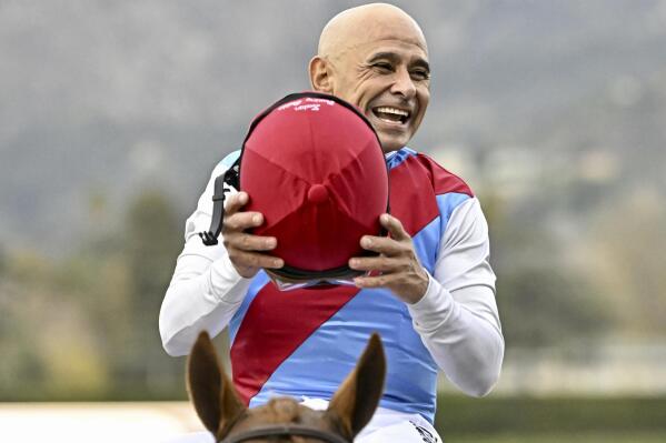 FILE - Jockey Mike Smith reacts after riding Taiba and winning the Malibu Stakes (Grade 1) race during opening day of the winter-spring meet at Santa Anita Park in Arcadia, Calif., Monday, Dec. 26, 2022. Smith will be a commentator for Fox’s coverage of the 153rd running of the Belmont Stakes on June 10, 2023. (Keith Birmingham/The Orange County Register via AP, File)