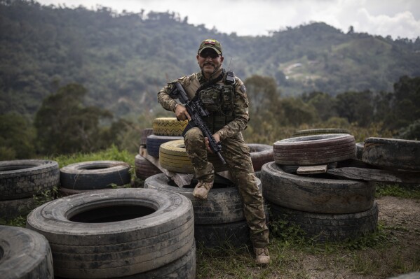 Hector Bernal, a military instructor, poses for a photo in La Mesa, Colombia, Wednesday, Jan. 10, 2024. Bernal, a retired combat medic who runs a center for tactical medicine outside Bogotá, says that in the last eight months he’s trained more than 20 Colombians who later went on to fight in Ukraine. He says that a professional soldier who has six years in the army doesn’t make more than $600 a month in Colombia but in Ukraine the soldiers are being paid $3000 to $4000 a month. (AP Photo/Ivan Valencia)
