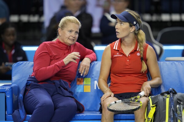 FILE - Captain Kathy Rinaldi, left, speaks with USA's Danielle Collins during Collins' match against Poland's Magdalena Frech on the second day of the Billie Jean King Cup finals at Emirates Arena in Glasgow, Scotland, Wednesday, Nov. 9, 2022. Former Billie Jean King Cup captain Rinaldi and current Davis Cup captain Bob Bryan will coach the U.S. tennis players at the Paris Olympics, the U.S. Tennis Association announced Monday, May 27, 2024. (AP Photo/Kin Cheung, File)