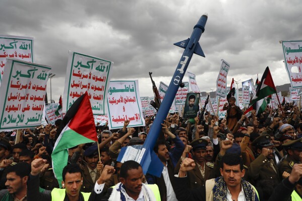 Houthi supporters attend a rally against the U.S.-led airstrikes on Yemen and in support of the Palestinians in the Gaza Strip on Yemen, in Sanaa, Yemen, Friday, Feb. 09, 2024. (AP Photo/Osamah Abdulrahman)
