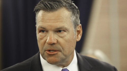 Kansas Attorney General Kris Kobach answers questions during a news conference about a new state law that defines male and female in state law so that transgender people can't change their driver's licenses and birth certificates to reflect their gender identities, Monday, June 26, 2023, at the Statehouse in Topeka, Kansas. The number of people making those changes jumped more than 300% this year ahead of the new law taking effect. (AP Photo/John Hanna)