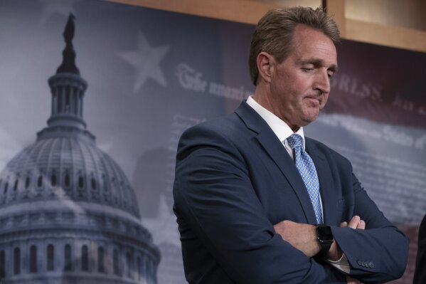 
              FILE - In this July 19, 2018, file photo, Sen. Jeff Flake, R-Ariz., talks to reporters after making a speech on the Senate floor on Capitol Hill in Washington. U.S. Rep. Martha McSally, R-Ariz., and U.S. Rep. Kirsten Sineam, D-Ariz., are seeking to fill the retiring Flake's seat. (AP Photo/J. Scott Applewhite, File)
            