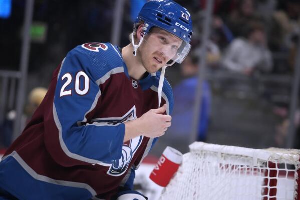 Colorado Avalanche center Lars Eller, just acquired from the Washington Capitals, warms up before the second period of the team's NHL hockey game against the New Jersey Devils on Wednesday, March 1, 2023, in Denver. (AP Photo/David Zalubowski)