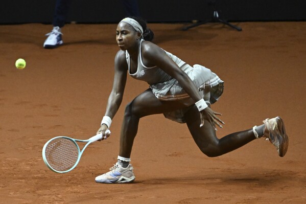United States' Coco Gauff returns the ball to Germany's Ella Seidel during their Stuttgart tennis tournament tennis match, in Stuttgart, Germany, Thursday, April 17, 2025. (Bernd Weißbrod/dpa via AP)