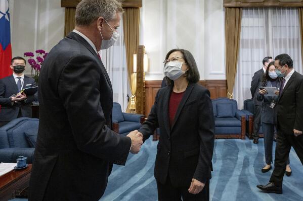 In this photo released by the Taiwan Presidential Office, Taiwan's President Tsai Ing-wen, right, meets with retired Adm. Phil Davidson, former head of the U.S. Inso-Pacific Command, in Taipei, Taiwan, Thursday, Feb. 2, 2023. (Taiwan Presidential Office via AP)