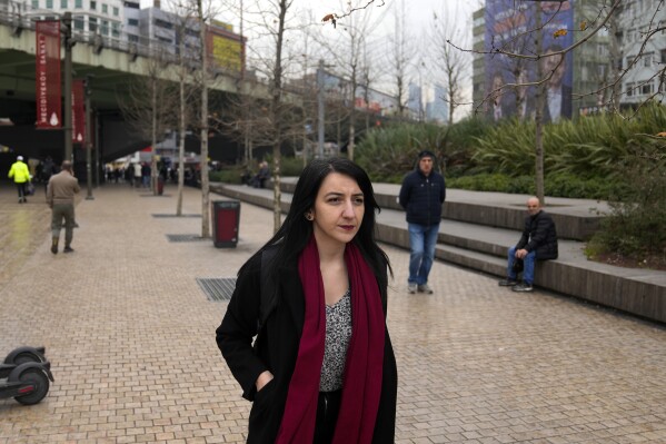 Fidan Ataselim, general secretary of We Will Stop Femicides Platform or WWSF, walks on the street following an interview with the Associated Press in Istanbul, Turkey, Tuesday, March 5, 2024. At least 403 women were killed in Turkey last year, most of them by current or former spouses and other men close to them, according to the We Will Stop Femicides Platform, a group that tracks gender-related killings and provides support to victims of violence. (AP Photo/Khalil Hamra)