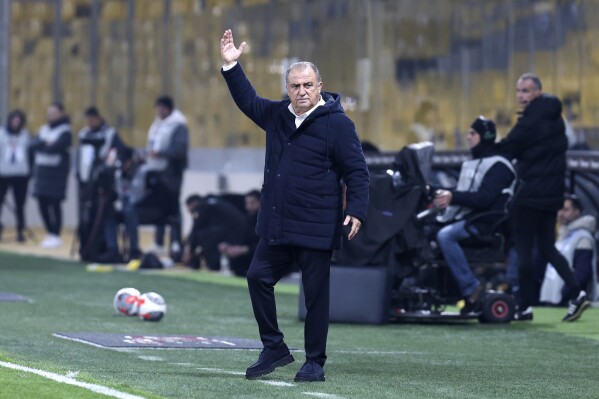 FILE - Panathinaikos' head coach Fatih Terim instructs his players during a Greek super League soccer match against AEK Athens, at OPAP Arena stadium, in Athens, Greece, Jan. 14, 2024. Turkish coach Fatih Terim on Friday, May 17, 2024, has announced his departure from Greek club Panathinaikos, one game before the end of the season. (AP Photo/Yorgos Karahalis, File)