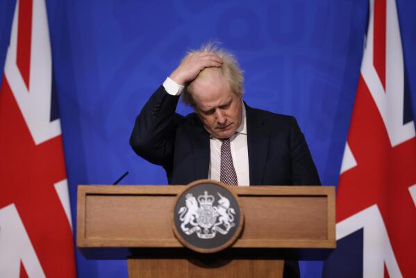 Britain's Prime Minister Boris Johnson gestures as he speaks during a press conference in London, Saturday Nov. 27, 2021, after cases of the new COVID-19 variant were confirmed in the UK. (Hollie Adams/Pool via AP)