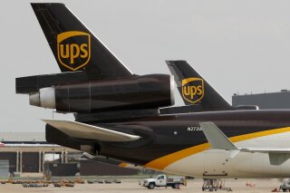 FILE - In this June 24, 2019, photo a UPS aircraft taxis to its hangar area after it arrived at Dallas-Fort Worth International Airport in Grapevine, Texas. UPS says it won government approval to run a drone airline, and it plans to expand deliveries on hospital campuses and eventually other industries. United Parcel Service Inc. said Tuesday, Oct. 1, that its drone subsidiary was awarded an airline certificate last week by the Federal Aviation Administration. (AP Photo/Tony Gutierrez, File)