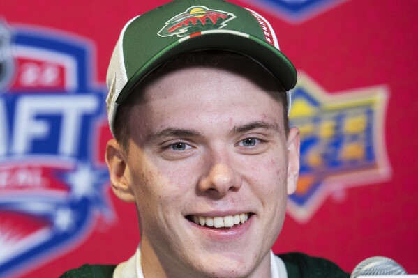 Danila Yurov speaks during a news conference after being selected by the Minnesota Wild during the first round of the NHL hockey draft in Montreal on Thursday, July 7, 2022. (Graham Hughes/The Canadian Press via AP, file)