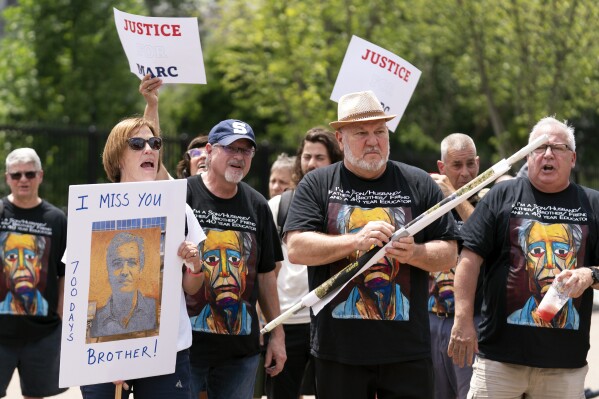 Lisa Hyland, left, and other family members of Marc Fogel, who has been detained in Russia since August 2021, rally outside the White House for his release, July 15, 2023, in Washington. (AP Photo/Stephanie Scarbrough, File)