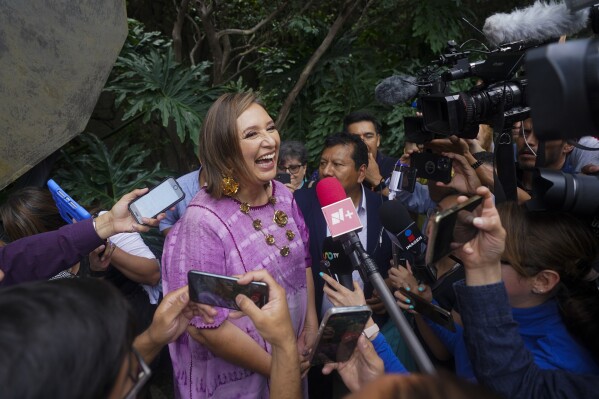 FILE - Senator Xochitl Galvez, an opposition presidential hopeful, speaks to the press after registering her name as a candidate in Mexico City, July 4, 2023. The street saleswoman turned tech entrepreneur is shaking up the contest to succeed Mexico's popular president, offering an alternative to Mexican President Andrés Manuel López Obrador’s dominant party. (AP Photo/Fernando Llano, File)