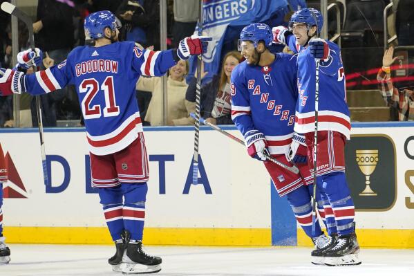 New York Rangers center Filip Chytil, right, celebrates with teammates after scoring winning goal during overtime of an NHL hockey game against the New Jersey Devils, Monday, Dec. 12, 2022, at Madison Square Garden in New York. (AP Photo/Mary Altaffer)