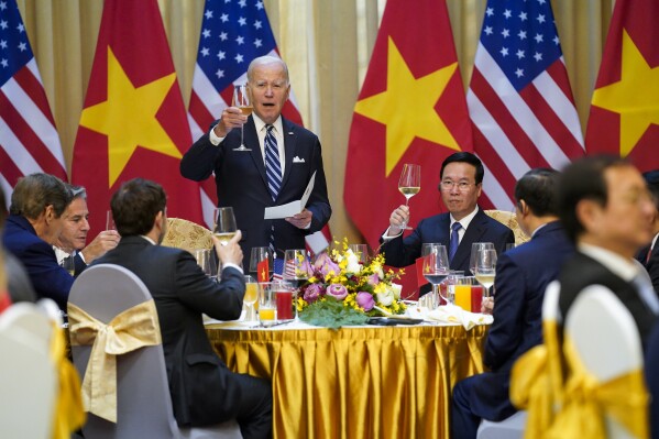 U.S. President Joe Biden raises a toast as he participates in a State Luncheon with Vietnam President Vo Van Thuong in Hanoi, Vietnam, Monday, Sept. 11, 2023. (AP Photo/Evan Vucci)